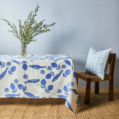 plant in the vase placed on table with bonnie and beil linen table cloth with blue sardines design print