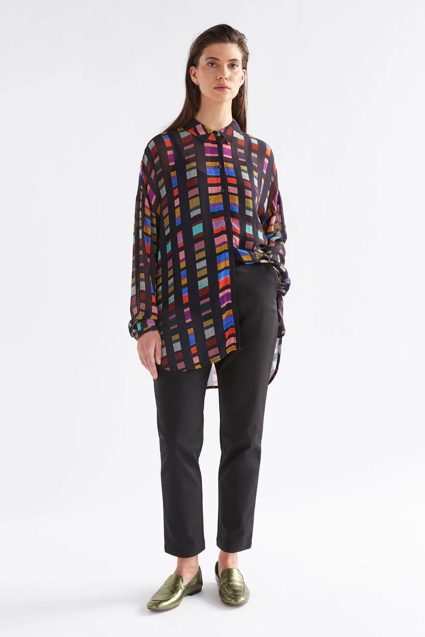 woman wearing elk the label eir sheer shirt in tessela print and black pants