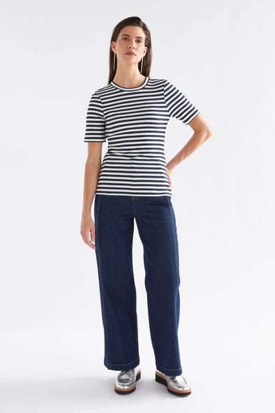 woman wearing kullan ribbed shirt white ink stripe and dark blue denim pants