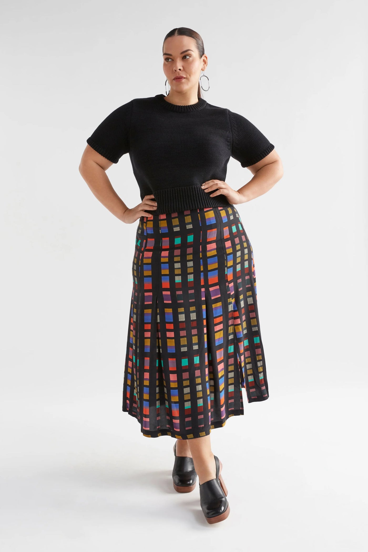 Plus Size Woman wearing Black Lift Knit Top and Multi-coloured skirt