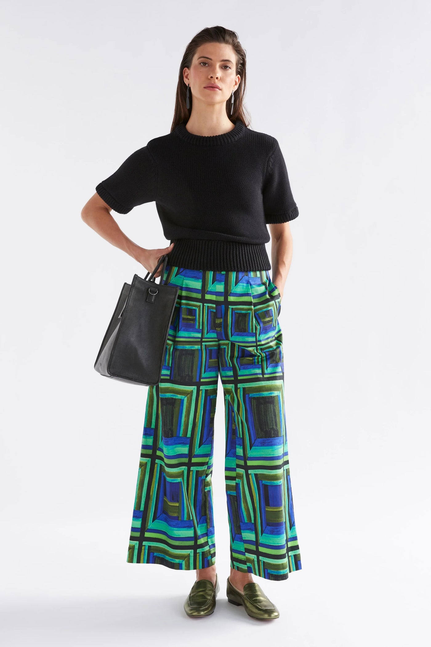 Woman wearing Black Lift Knit Top and Blue green square printed pants