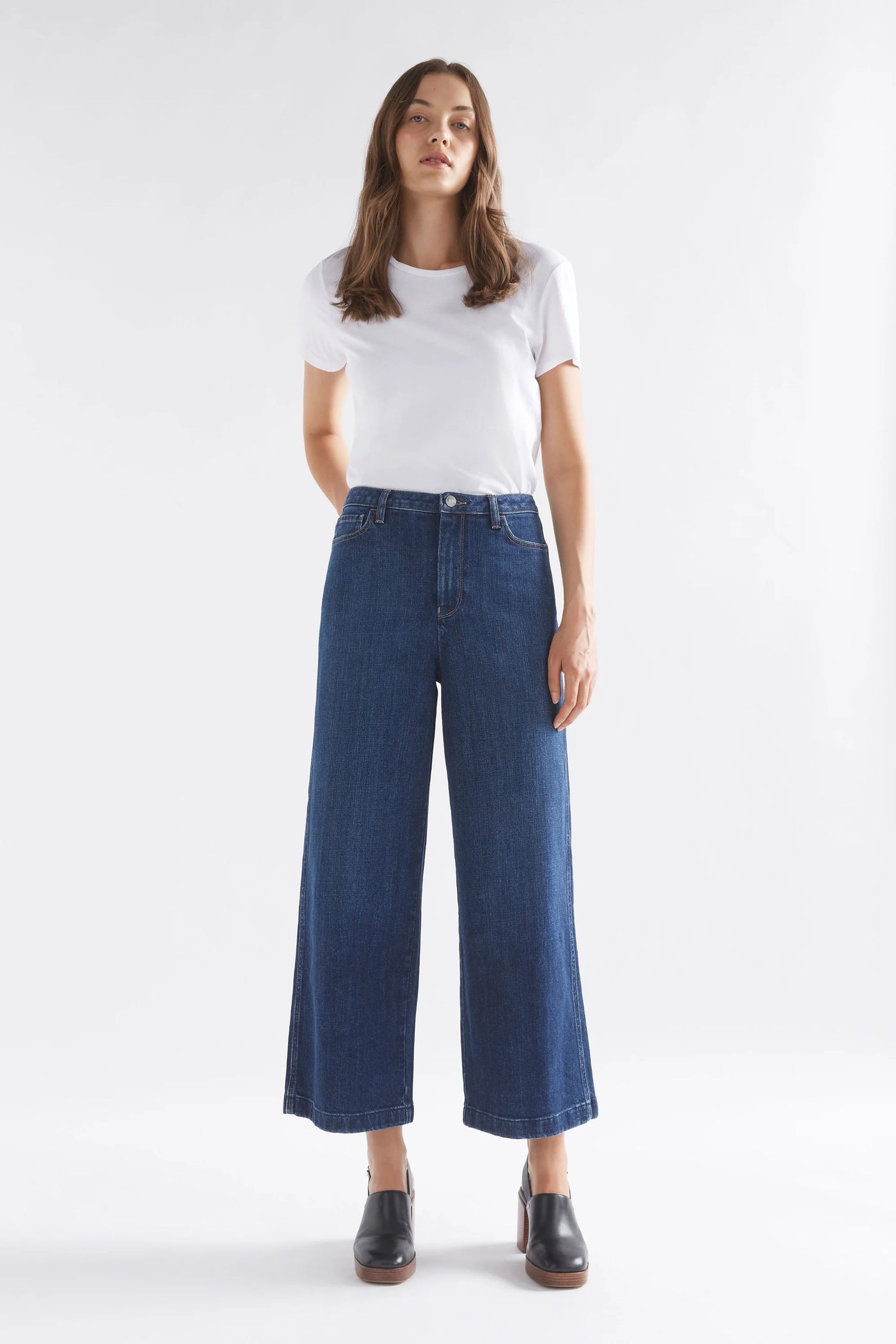 Woman wearing White top and Tovi Regen Jean Dark Blue