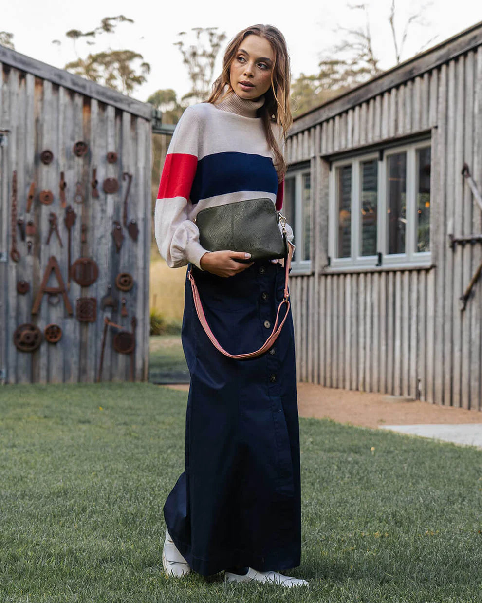 Woman holding Elm and King Burbank Crossbody Large Bag in Khaki