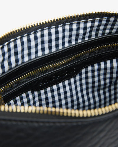 Closer look of inside the back - checkered inside with zipper