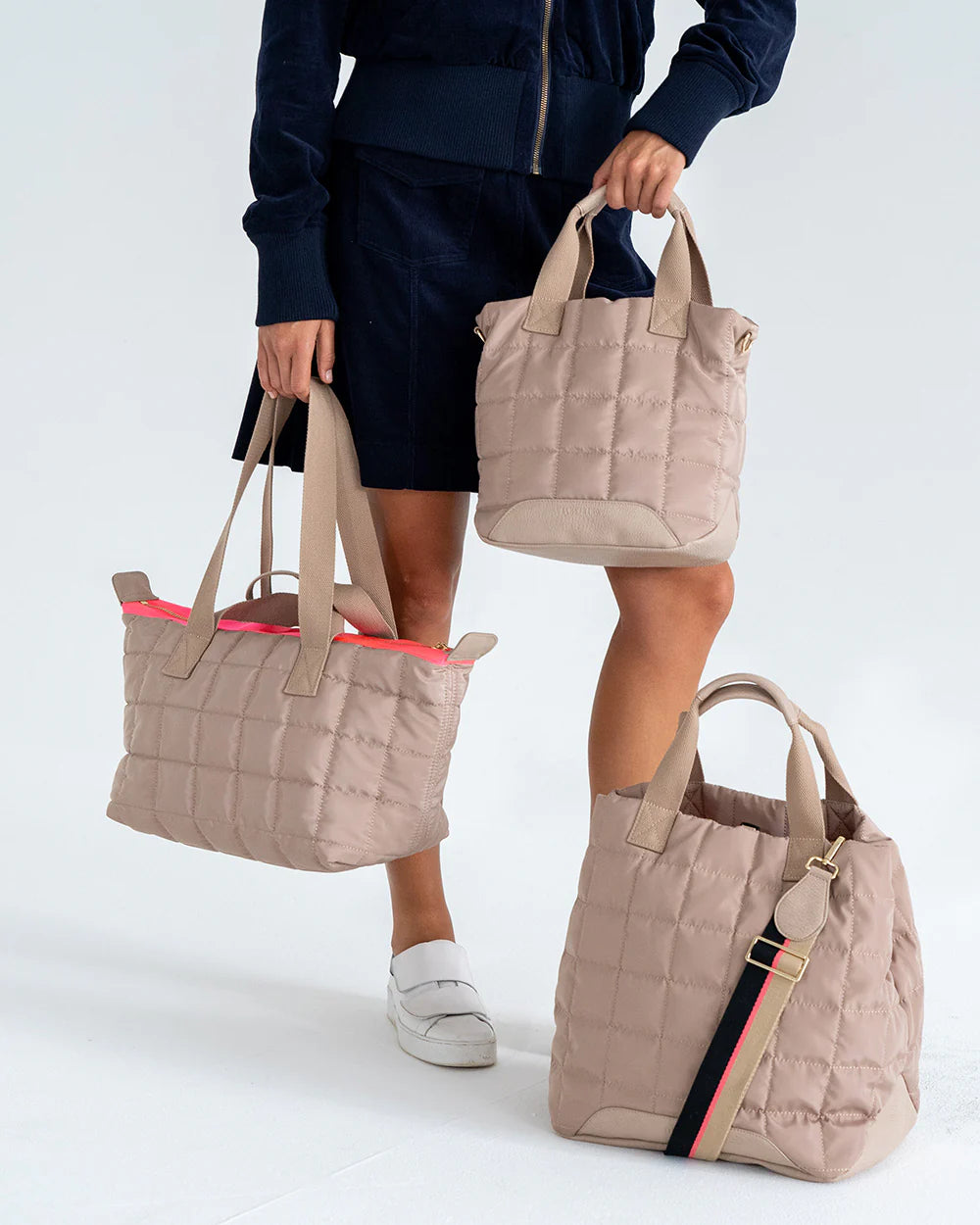 Woman with 3 bags in Taupe colour