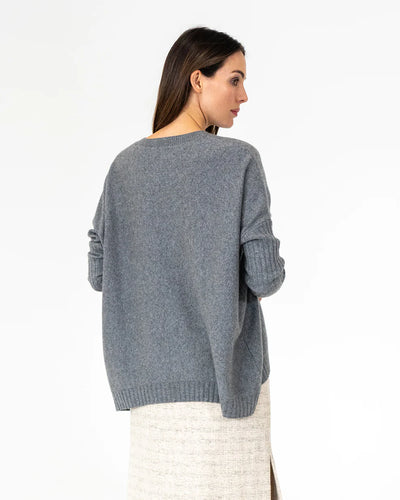 Woman wearing Sadie Crew Neck in Terrier Grey and Maxi Skirt Tweed back view