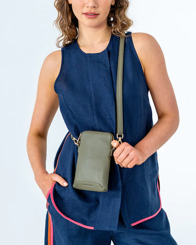 Woman wearing Elm and King Sullivan Phone Bag in Khaki