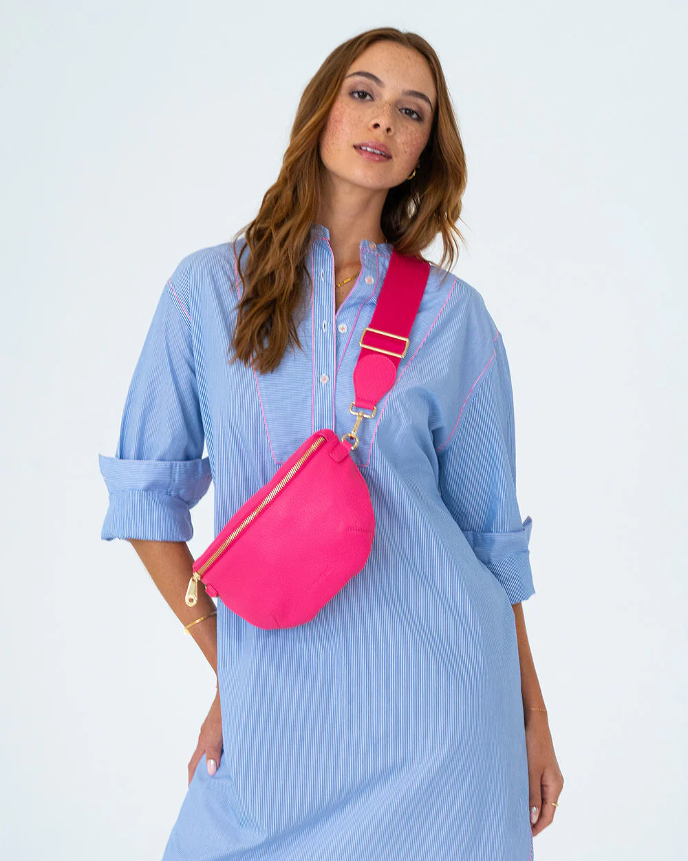 woman wearing blue long sleeve dress and Alamo Sling - Fuchsia