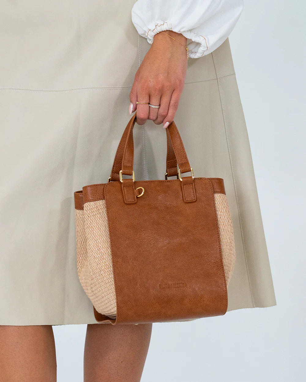 woman's hand holding Carnegie Tote - Natural/Tan