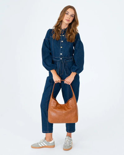 Woman holding Arcadia Tote in Tan Pebble front view