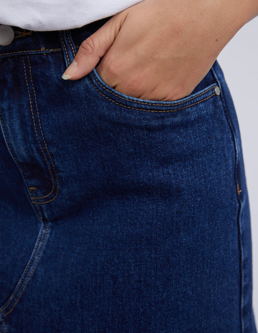 Closer look of hand in the skirt pocket