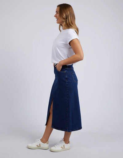 Full image of Woman wearing Scout Midi Skirt in Indigo side view