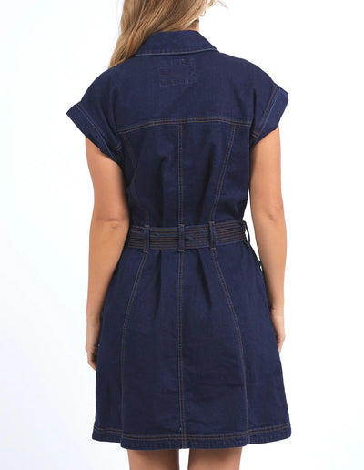 Woman facing the back wearing foxwood heidi dress in dark blue denim