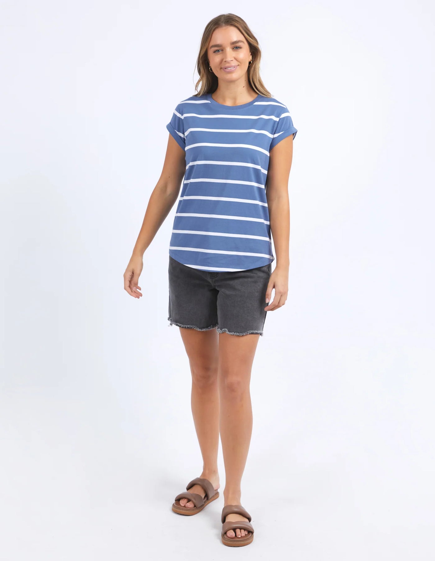 Woman wearing foxwood manly blue and white stripe tee and black denim short