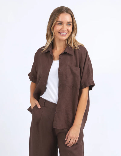 Woman wearing white inner and foxwood pierra shirt and pants in chocolate colour