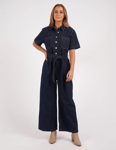 Woman wearing Lorena Jumpsuit Indigo Denim