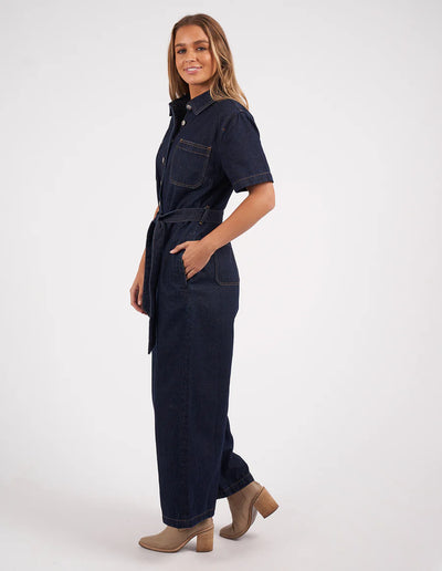 Woman wearing Lorena Jumpsuit Indigo Denim