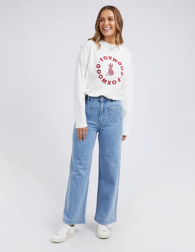 Woman wearing white long sleeve top and Sarah Wide Leg Jean Light Blue