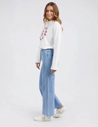 Woman wearing white long sleeve top and Foxwood Sarah Wide Leg Jean Light Blue