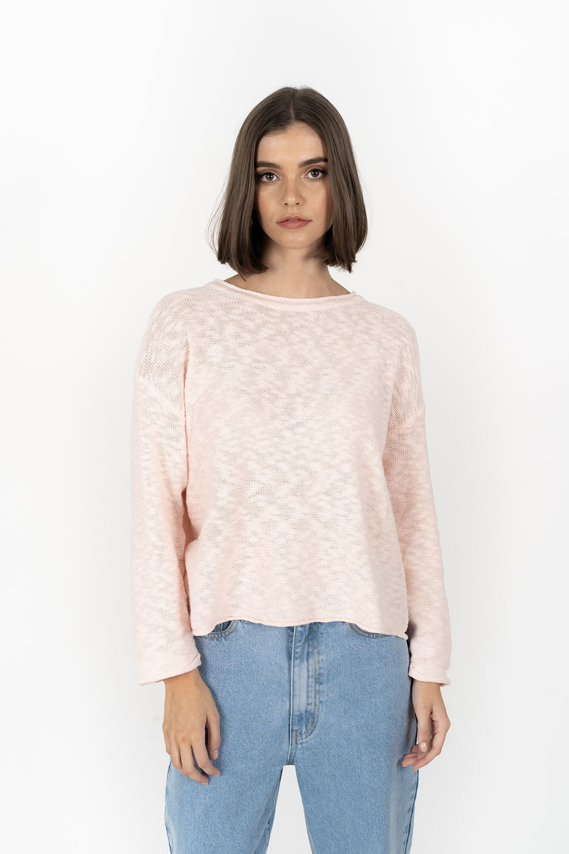 Woman wearing Sofia sweater in peach front view