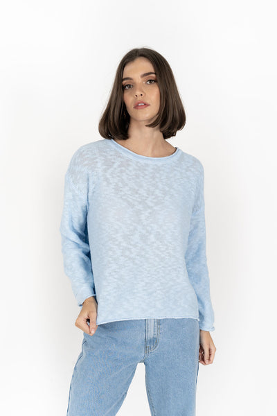 Woman wearing Humidity Lifestyle Sofia Sweater in Powder Blue