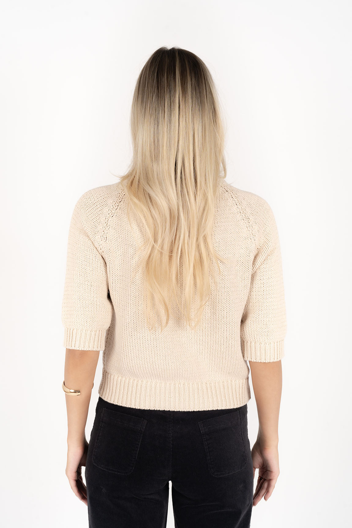 Woman wearing Transit Jumper in Stone colour back view