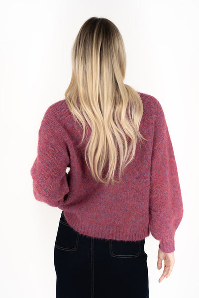 Woman facing the back wearing Neve Jumper in Berry and Nevada skirt in black