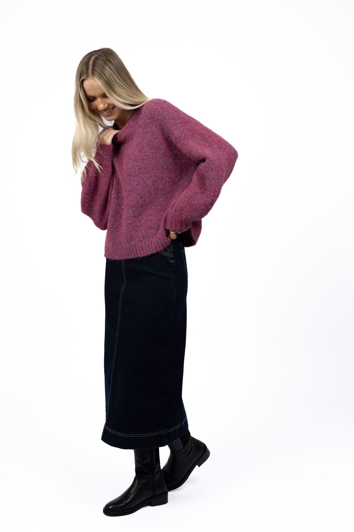 Woman wearing Neve Jumper in Berry and Nevada skirt in black