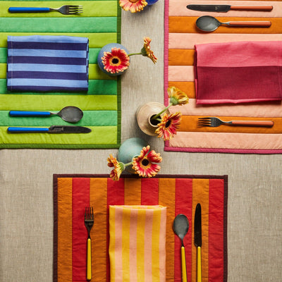 top view of table with napkins and spoon fork set up