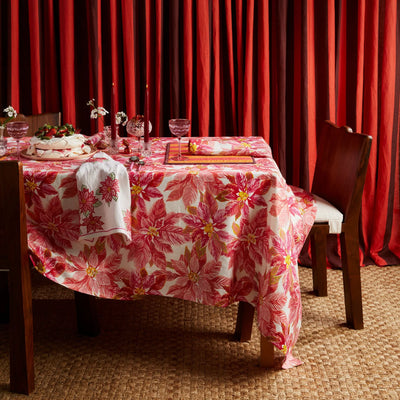 candle light, tableware, cake placed on dining table with bonnie and neil poinsettia red tablecloth