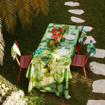 garden with dining set with table decorated with bonnie and neil rosetta blue tablecloth and napkins