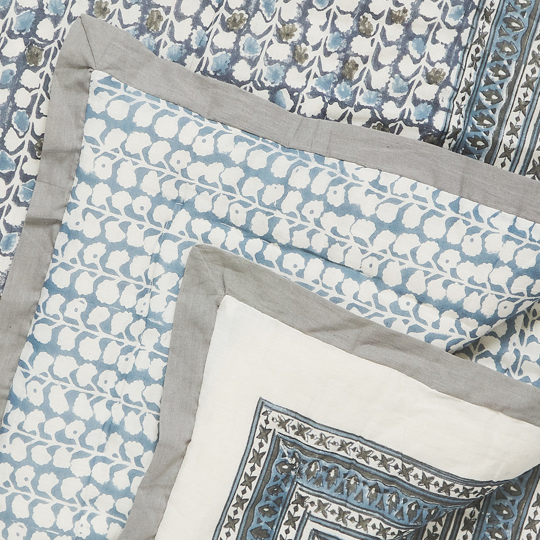 closer look to the canvas and sasson fontaine quilt cornflower blue features an all-over hand-block printed design