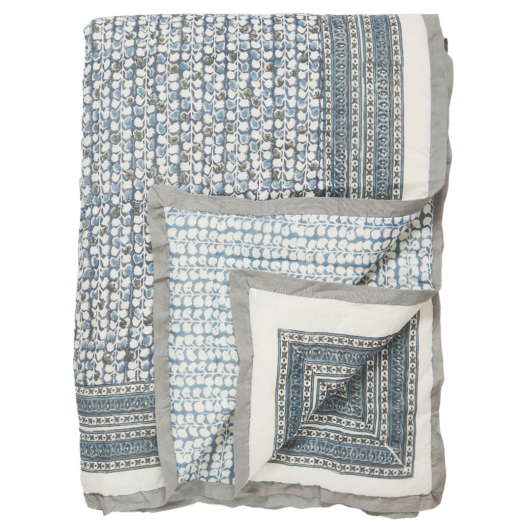 canvas and sasson folded fontaine quilt in cornflower blue features an all-over hand-block printed design with a border