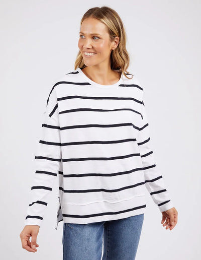 woman wearing denim pants and foxwood jayne stripe throw on top white dark  sapphire stripe