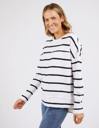 woman wearing denim pants and foxwood jayne stripe throw on top white dark  sapphire stripe