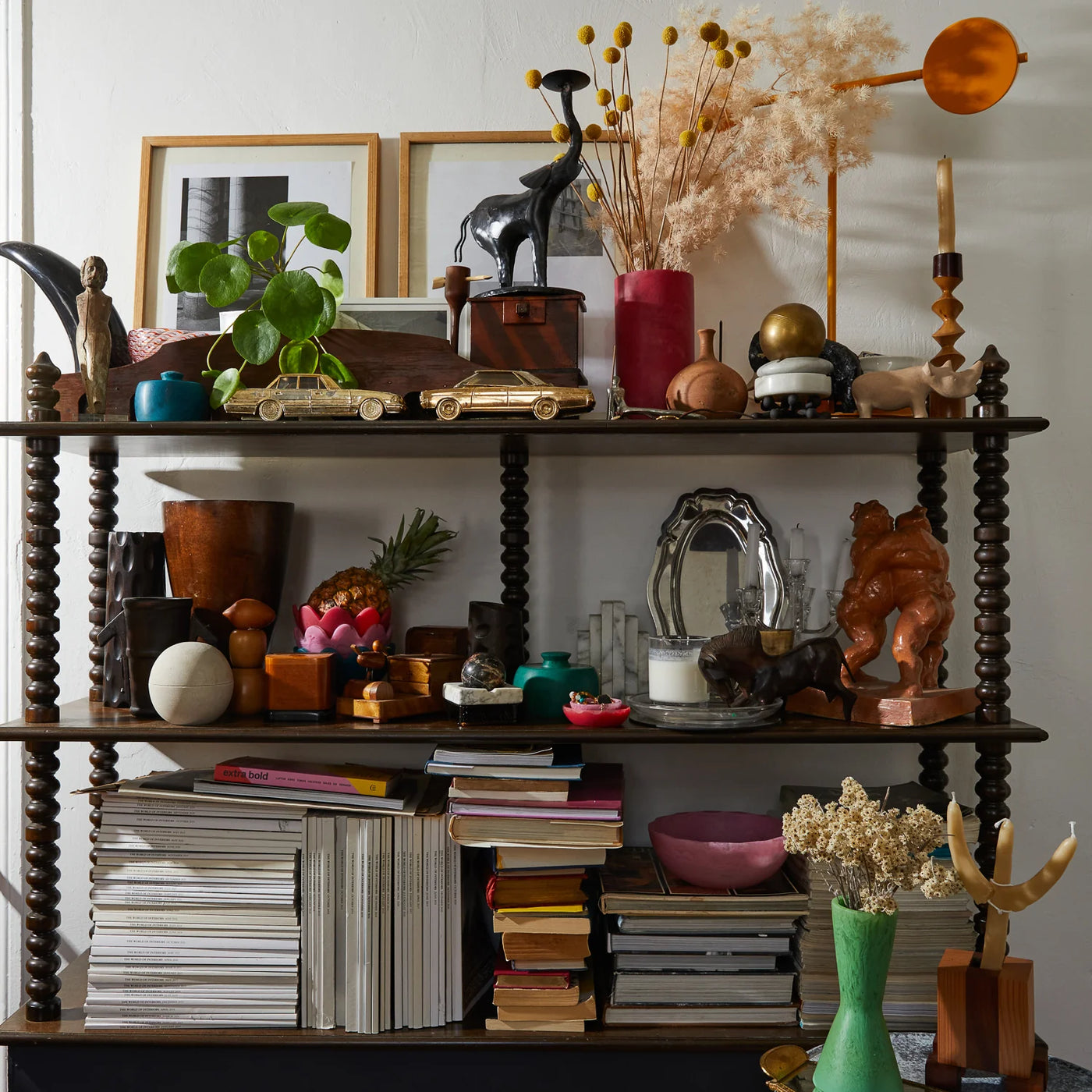 cabinet with books, bowls, vases