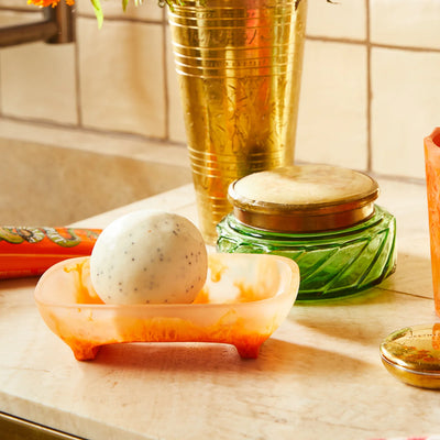 sage and clare daja soap dish persimmon with circular soap placed in the table