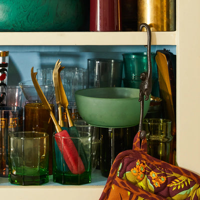 cabinet with glasses and penny cheese knife in capri