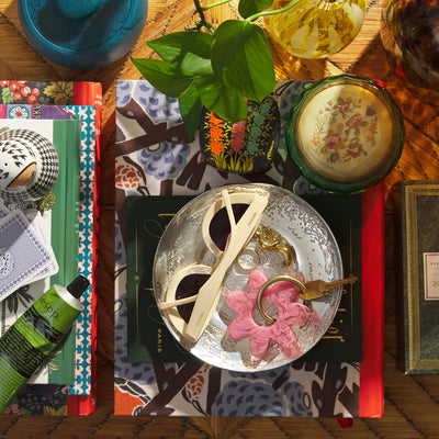 Table with books, shades, and key ring top view