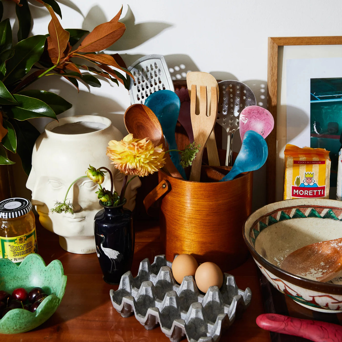 table with eggs, bowl and Wilkie Salad Servers in different colours